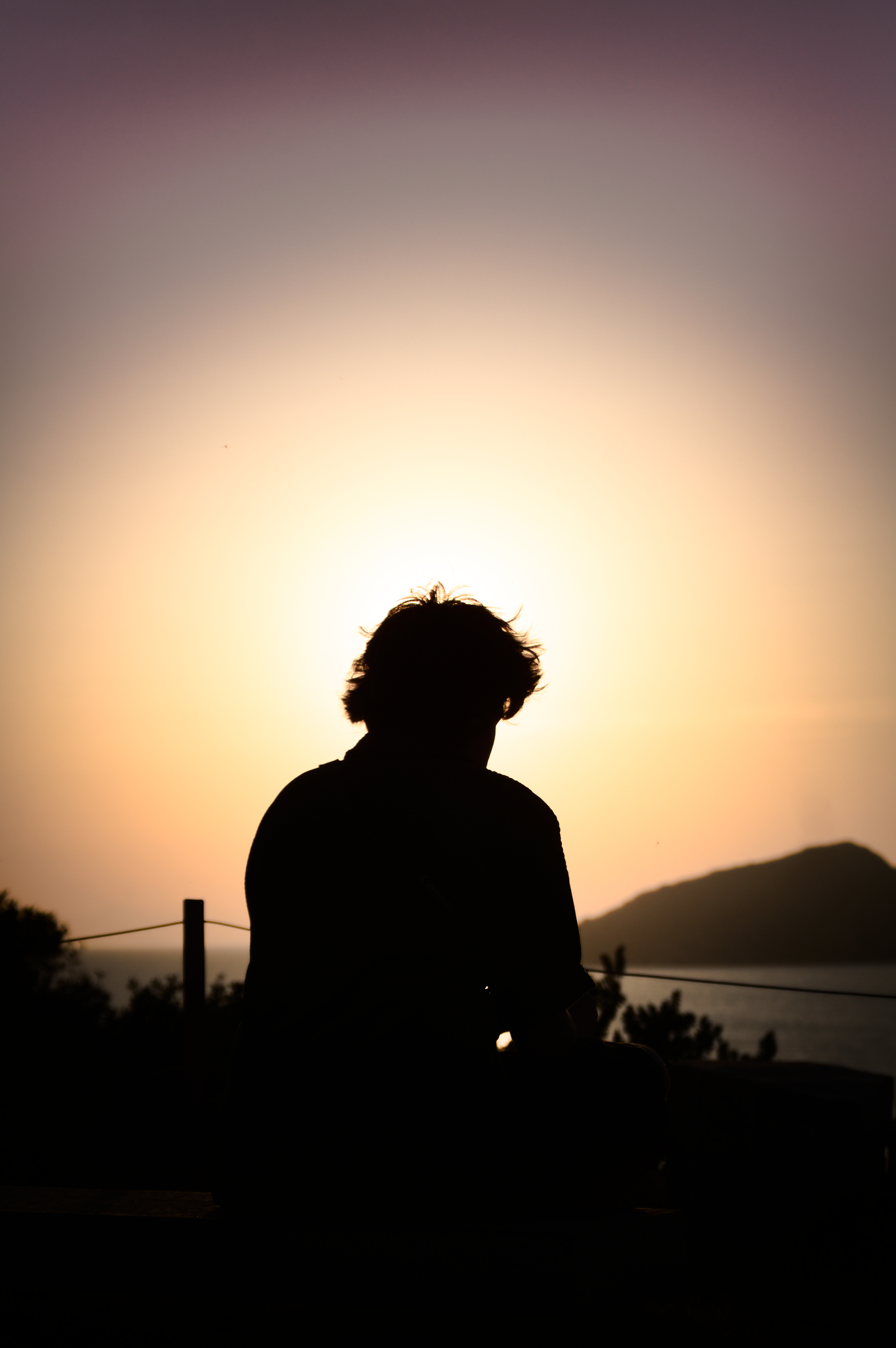 Jude on a bench at sunset, Greece
